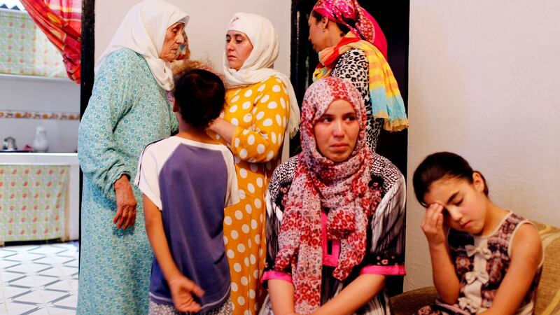 Family members of Barcelona attack suspects Younes and El Houssaine Abouyaaqoub, and Mohammed and Omar Hychami are pictured in their family home. Photograph:  Reuters/Youssef Boudlal