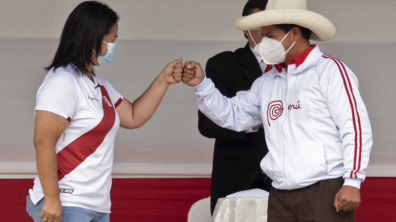 Pedro Castillo and right-wing presidential rival Keiko Fujimori shake fists ahead of a debate in  Cajamarca, northern Peru on May 1st. Photograph:  Cesar Bazan/AFP via Getty Images