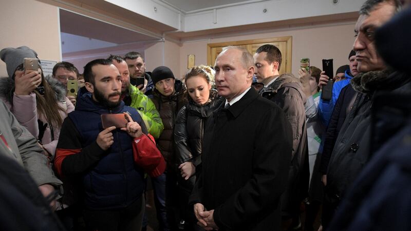 Russian president Vladimir Putin meets locals and relatives of missing persons in the Siberian city of Kemerovo on Tuesday. Photograph: Alexei Druzhinin/Kremlin via Reuters