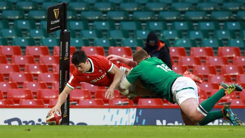 Louis Rees-Zammit touches down to score Wales’s second try as Tadhg Furlong attempts to tackle during the Guinness Six Nations match between Wales and Ireland at the Principality Stadium in Cardiff on Sunday. Photograph: David Rogers/Getty Images