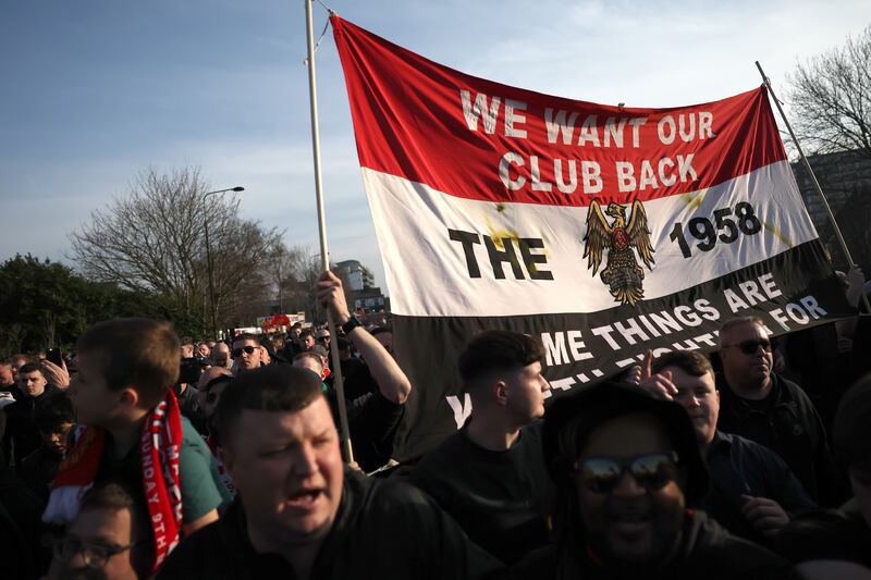 Manchester United fans protest ahead of Sunday's Premier League game against Arsenal at Old Trafford. Photograph: Carl Recine/Getty Images