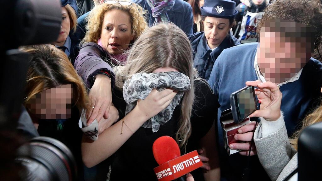 A 19-year-old British woman arriving at Famagusta district court for sentencing on Tuesday. Photograph: Petros Karadjias/AP