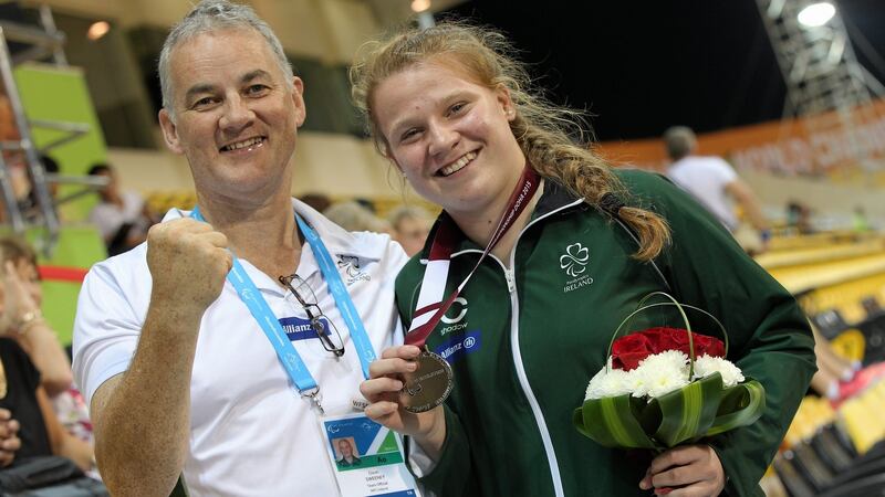 Ireland’s Noelle Lenihan celebrates her silver medal with coach Dave Sweeney at the World Paralympics Games in Doha, Qatar. Photograph:  Marcus Hartmann/Sportsfile