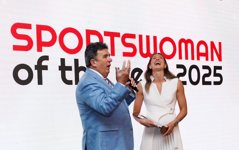 The Irish Times/Sport Ireland Sportswoman of the Year for 2025, Kate O’Connor, listens to Des Cahill at the awards ceremony. Photograph: Tom Maher/Inpho