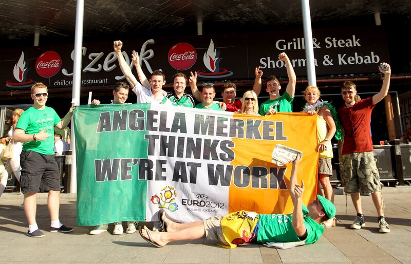 Irish fans with the Angela Merkel flag during Euros 2012. Photograph: 
James Crombie/Inpho