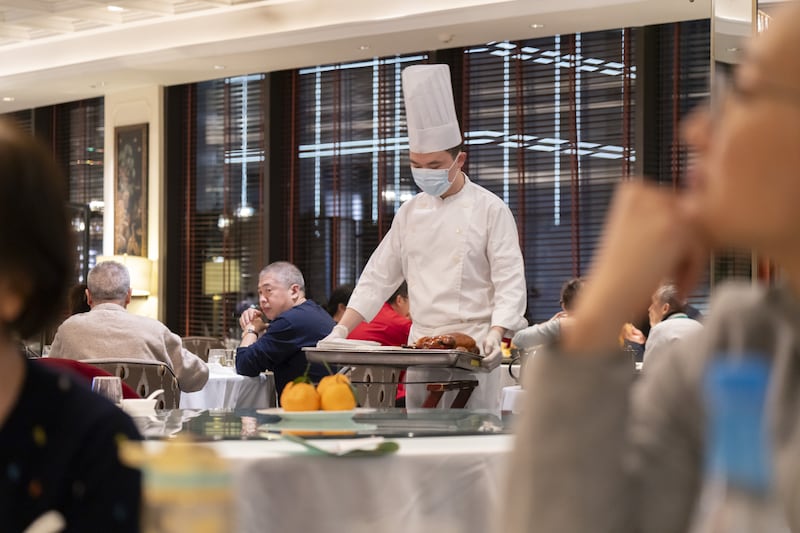 A chef at a restaurant in Shanghai, China. Photographer: Qilai Shen/Bloomberg via Getty Images
