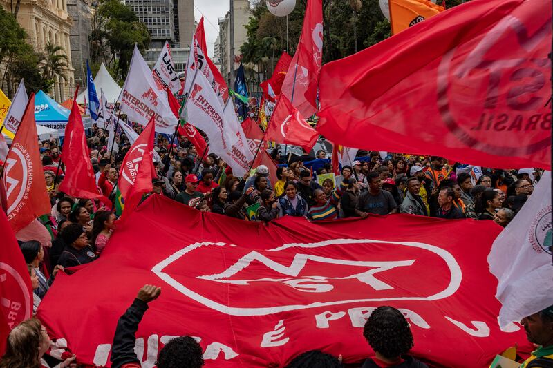 Supporters of Brazil's president Luiz Inácio Lula da Silva in São Paulo on Sunday. Photograph: Victor Moriyama/New York Times
                      