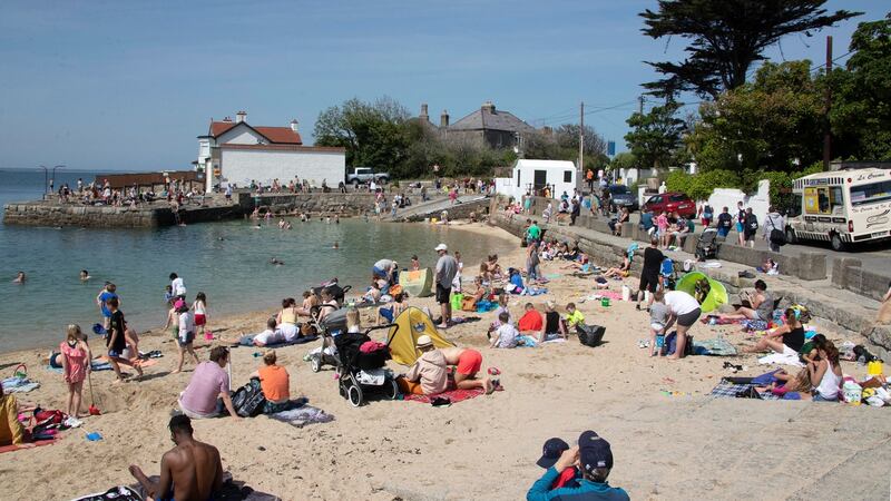 Sunbathers enjoying the fine weather at Sandycove on Thursday afternoon. Photograph:  Colin Keegan, Collins Dublin