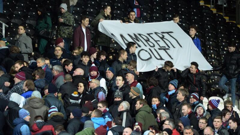 Aston Villa supporters unveil a “Lambert Out” banner at the end of the English Premier League defeat to  Hull City   at the KC Stadium  on February 10th. Photograph: Oli Scarff / AFP / Getty Images