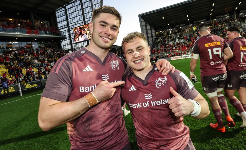 Munster's Jack Crowley and Craig Casey celebrate winning the match. Photograph: Billy Stickland/Inpho