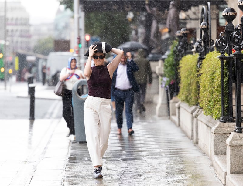 People caught in a sudden rain shower in Dublin city centre. Photograph: Sam Boal/Collins Photos

