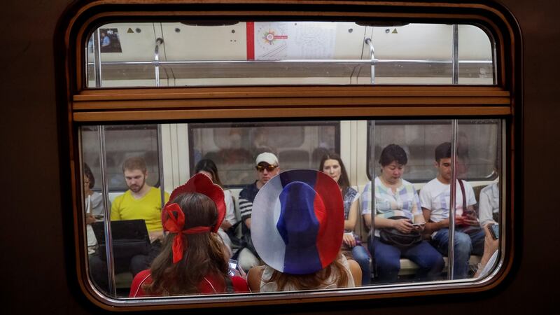 People ride the metro after the World Cup final  in Moscow on July 15th. Photograph: Gleb Garanich/Reuters