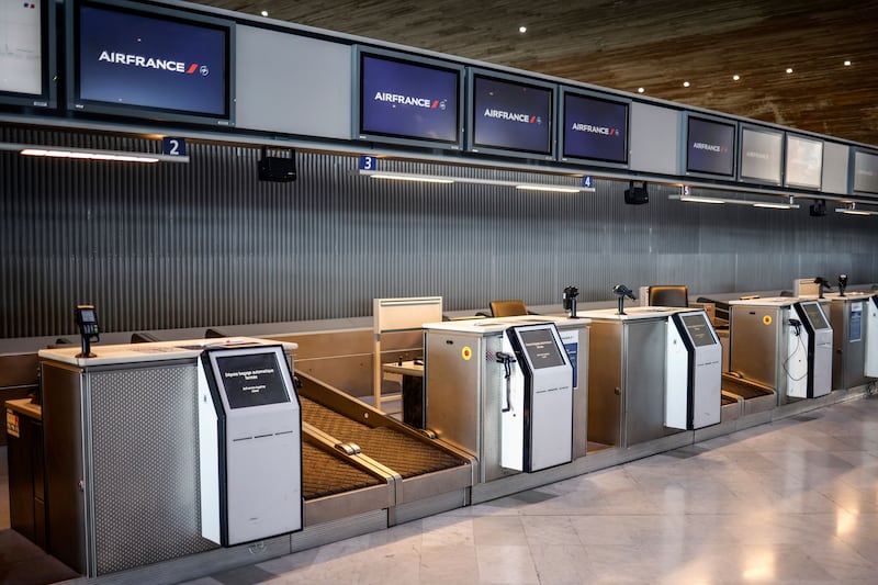 Empty check-in desks inside Roissy-Charles de Gaulle Airport during a French air traffic controllers' strike. Photograph: EPA