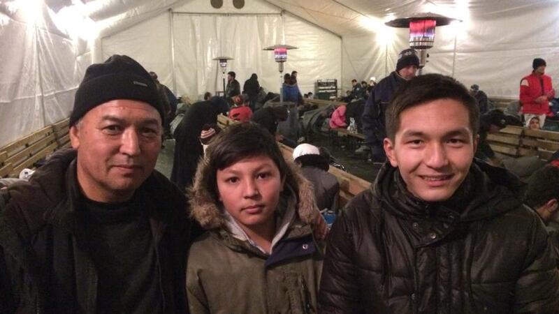 Afghan refugees Mohammed Hadi Raji and his grandnephews Mohammed Rashed and Rohullah. Photograph: Daniel McLaughlin