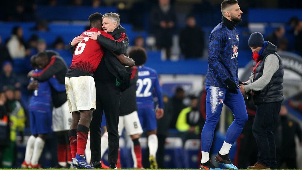 Manchester United’s Paul Pogba and Ole Gunnar Solskjaer after their FA Cup fifth round win over Chelsea. Photo: Nigel French/PA Wire