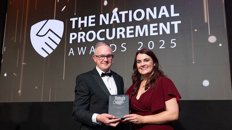 Michael O'Callaghan, awards judge, presents the procurement rising star of the year award to Aisling O'Brien, An Post.