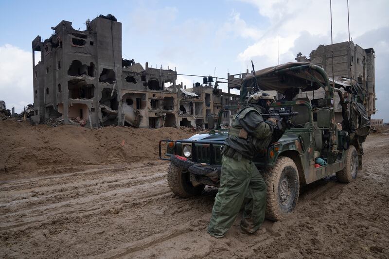 An Israeli soldier stands guard in Khan Younis. Photograph: Sam McNeil/AP 