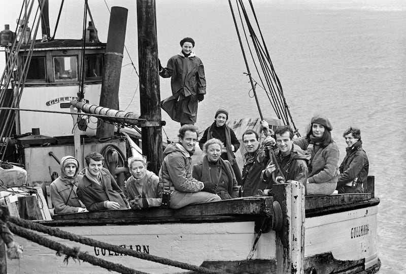 Members of the Druid Theatre cast and crew on board the fishing trawler Gullmarn at Galway Docks before their first visit to Inis Meáin, with The Playboy of the Western World in 1982: Maurice Sheehan, Yannig Guiomard, Marie Mullen, Jerome Hynes, Joan Sheehy, Maelíosa Stafford, Seán McGinley, Mary Ryan and David Calvert. Behind are Bríd Brennan and Garry Hynes