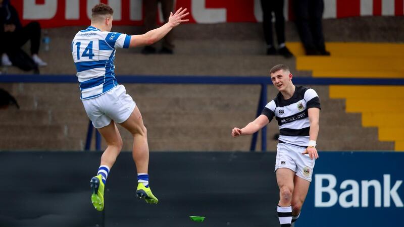 PBC’s Louis Bruce takes a kick as  Jack Hunt of Rockwell attempts a block during the  Munster Schools Senior Cup quarter-final  at Musgrave Park. Photograph: Oisín Keniry/Inpho