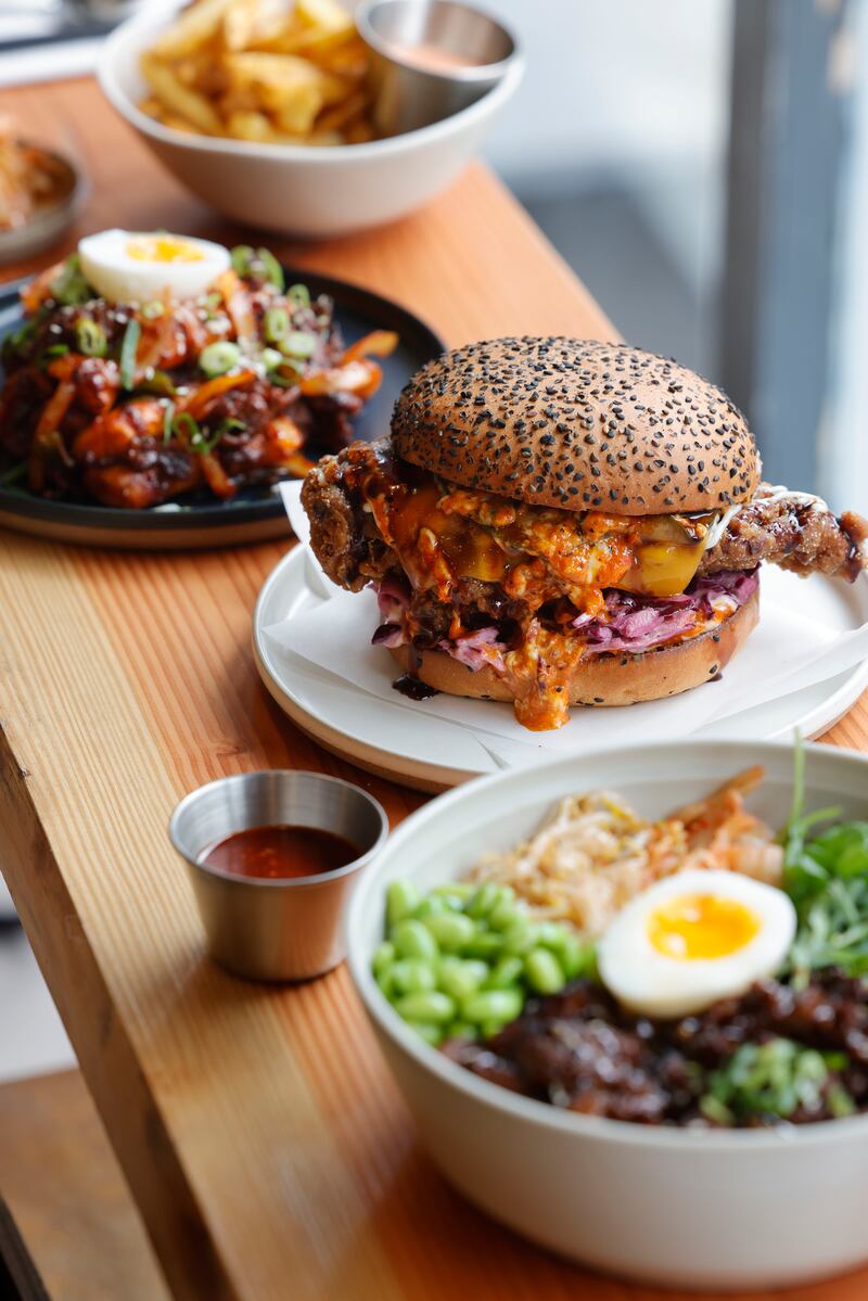 Tteokbokki, roasted rice cake, gochujang pork, scallions, egg, Seoul Burger, and Beef Bulgogi, with soy, apple & garlic marinade at Space Jaru. Photograph: Alan Betson