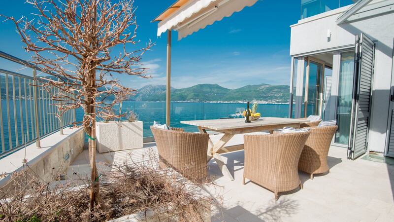 10 minutes from Tivat in Krasici is this 285sq m, four-bed, three-bath, two-level waterfront villa with  panoramic views.