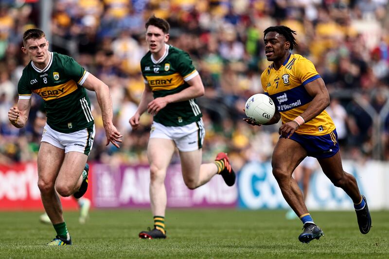 Kerry's Diarmuid O'Connor with Ikem Ugweru of Clare in the Munster Senior Football Championship Final, Cusack Park, Ennis. Photograph:
©INPHO/Ben Brady
