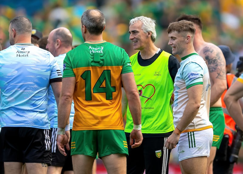 Donegal manager Jim McGuinness with his players after the game. Photograph: Tom O’Hanlon/Inpho