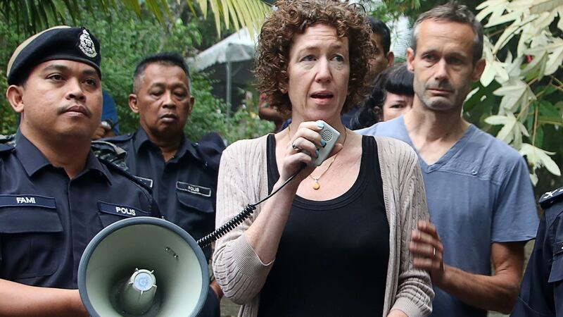 Nóra Quoirin’s parents Meabh (centre) and Sebastien (right), with the police as they  searched for her in Seremban. Photograph: Royal Malaysia Police/AFP/Getty Images
