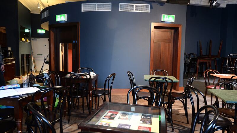 The set-up in the theatre is just as before: chairs and tables, but some now have glass tops  with  memorabilia beneath.  Photograph: Dara Mac Dónaill/The Irish Times