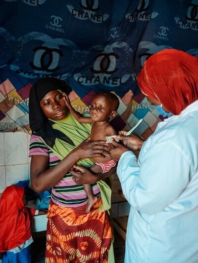 Sauweka Son Allah (20), is mother to twins Hassan and Housseini (16 months), who is being screened for malnutrition at the Integrated Health Centre (CSI) Koufan, Niger