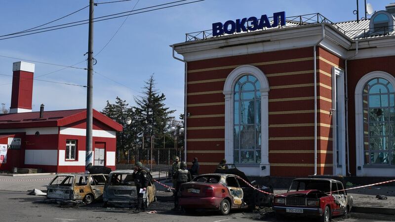 Ukrainian servicemen stand next to damaged cars after Russian shelling at the railway station in Kramatorsk, Ukraine, Friday, April 8th, 2022. Photograph: Andriy Andriyenko/AP