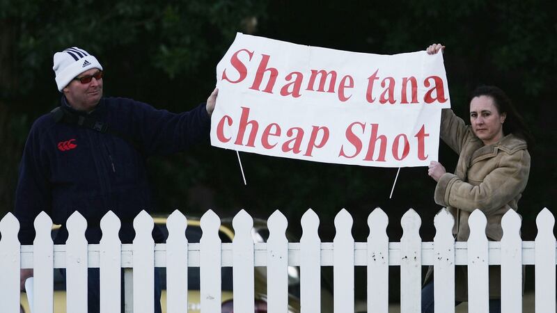 Fans hold up a banner showing their feelings over Tana Umaga and Kevin Mealamu’s  tackle on Brian O’Driscoll during a New Zealand training session in Wellington. Photograph: Shaun Botterill/Getty Images