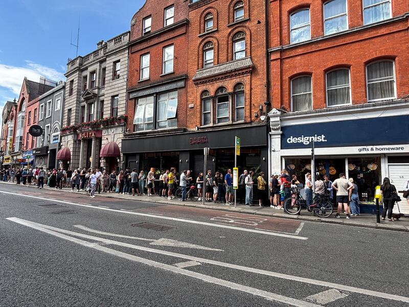 Hundreds of people queued down South Great George's Street on Wednesday to be in with a chance of picking up some of the last pairs of solar glasses left available in Dublin. Photographer: Conor Healy/The Irish Times