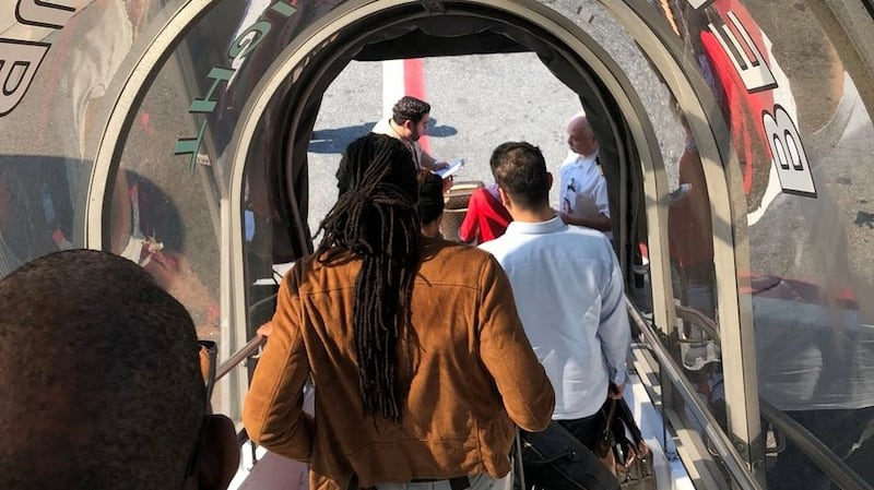 Passengers leave the plane being assisted by the air cabin crew and the emergency services on a flight from New York to Dubai, on JFK Airport, New York. Photograph: Larry Coben/via Reuters