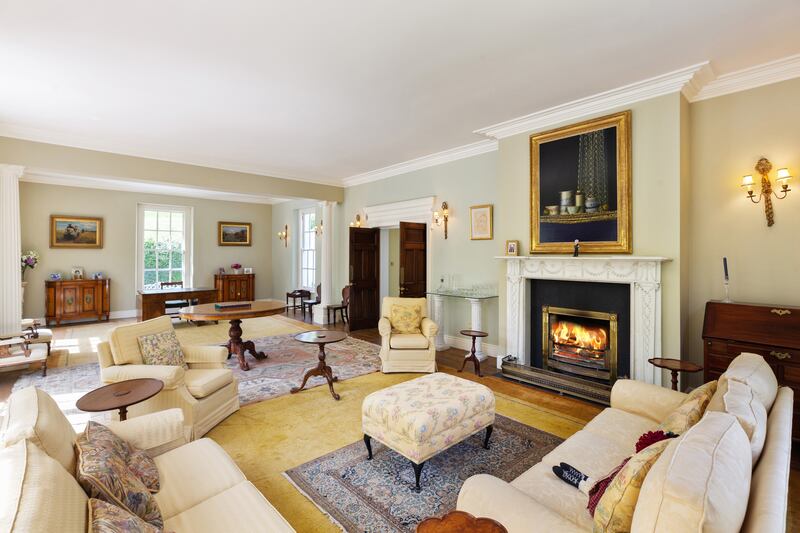The 'big reception room', as the owners call it, has tall sash windows looking east, west and north.