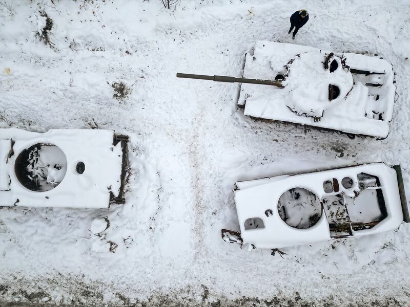 A man views destroyed Russian tanks outside Bucha on December 5th, 2022 in Bucha, Ukraine. Photograph: Jeff J Mitchell/Getty Images