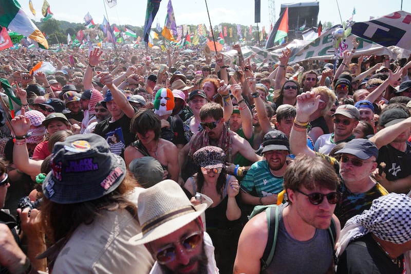 A crowd watches Kneecap performing on the West Holts Stage during the Glastonbury Festival  on Saturday afternoon. Photograph: Ben Birchall/PA Wire 