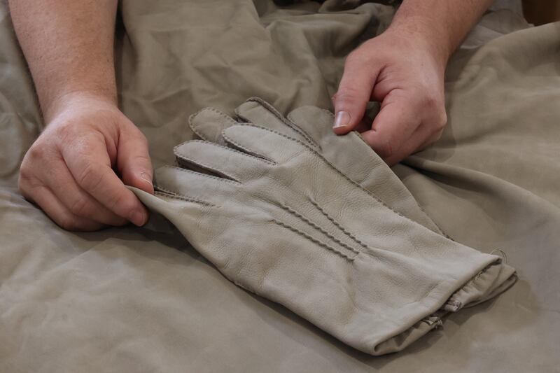 Detail of their formal grey hand-sewn gloves made from Mocca Suede.  Photograph: Nick Bradshaw