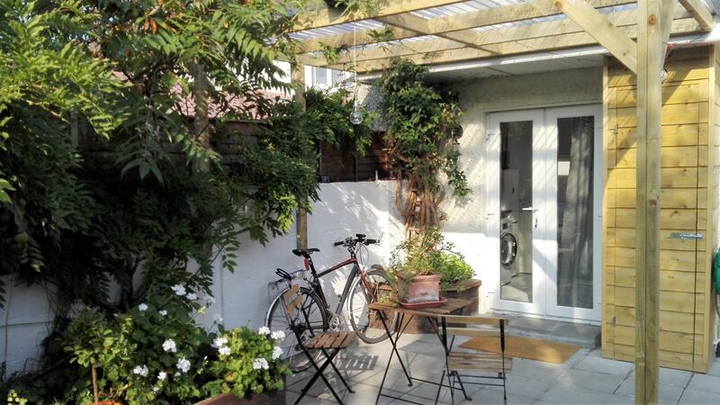 Patio outside Esther Waters’s garage conversion. Photograph: Nick Bradshaw