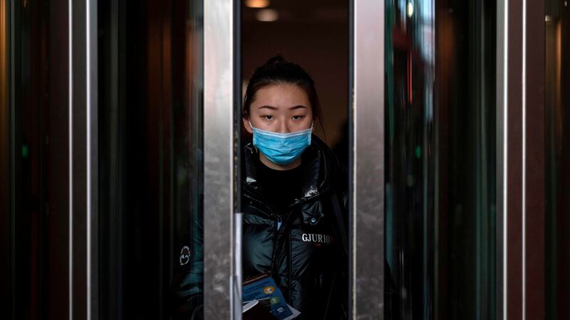 A passenger from a Chinese Hainan Airlines flight  from Beijing walks out of the arrivals gate at the Abelardo L Rodriguez International airport in Tijuana, Mexico, on January 27th. Photograph:  Guillermo Arias/AFP via Getty