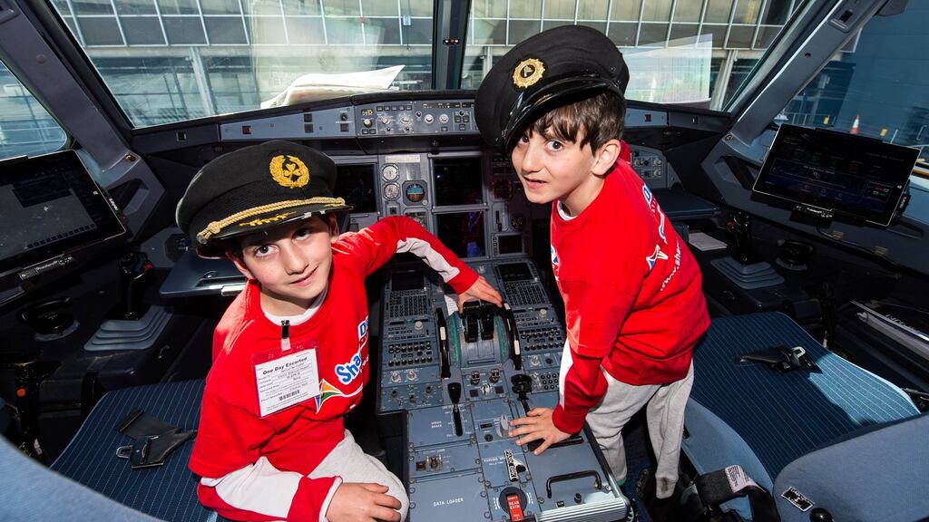 Hassan and Hussein Benhaffaf having fun on a dream day behind the scenes at Shannon airport. Photograph: Diarmuid Green