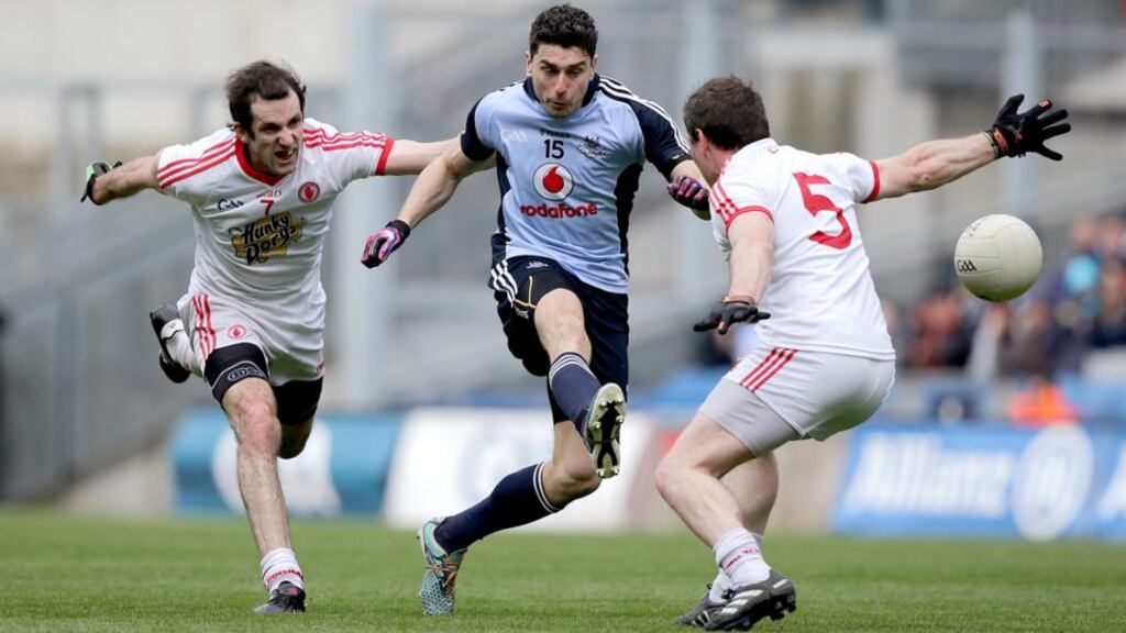 Dublin’s Bernard Brogan gets his shot away despite the efforts of Justin McMahon and Conor Gormley of Tyrone in yesterday’s final. Photograph: Morgan Treacy/inpho