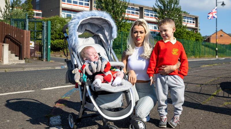 Alice-Lee Bunting, who attended Holy Cross Girls’ School Belfast 20 years ago during the Holy Cross dispute in Ardoyne, north Belfast,  with her sons Darraigh Bunting (4) and Keaghan Tommy Bunting (8 months). Photograph: Liam McBurney/PA Wire