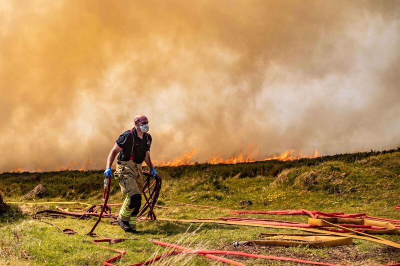 Firefighters battle a large gorse fire in the Dublin Mountains as crews work to contain the blaze. Photograph: Damien Storan