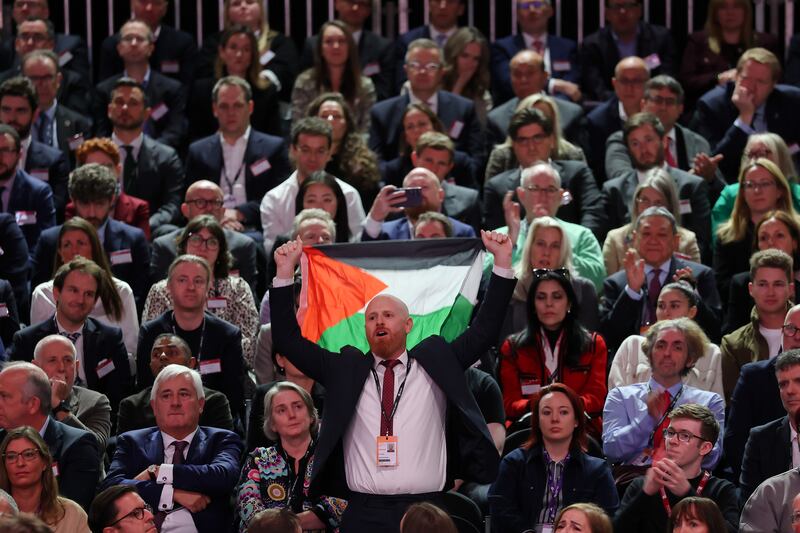 A protester holding a Palestinian flag interrupts a speech by Rachel Reeves. Photograph: Jeff J Mitchell/Getty Images