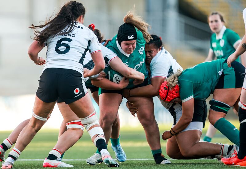 Ireland's Ellena Perry is tackled by Wales' Sisilia Tuipulotu. Photograph: Nick Elliott/Ipho