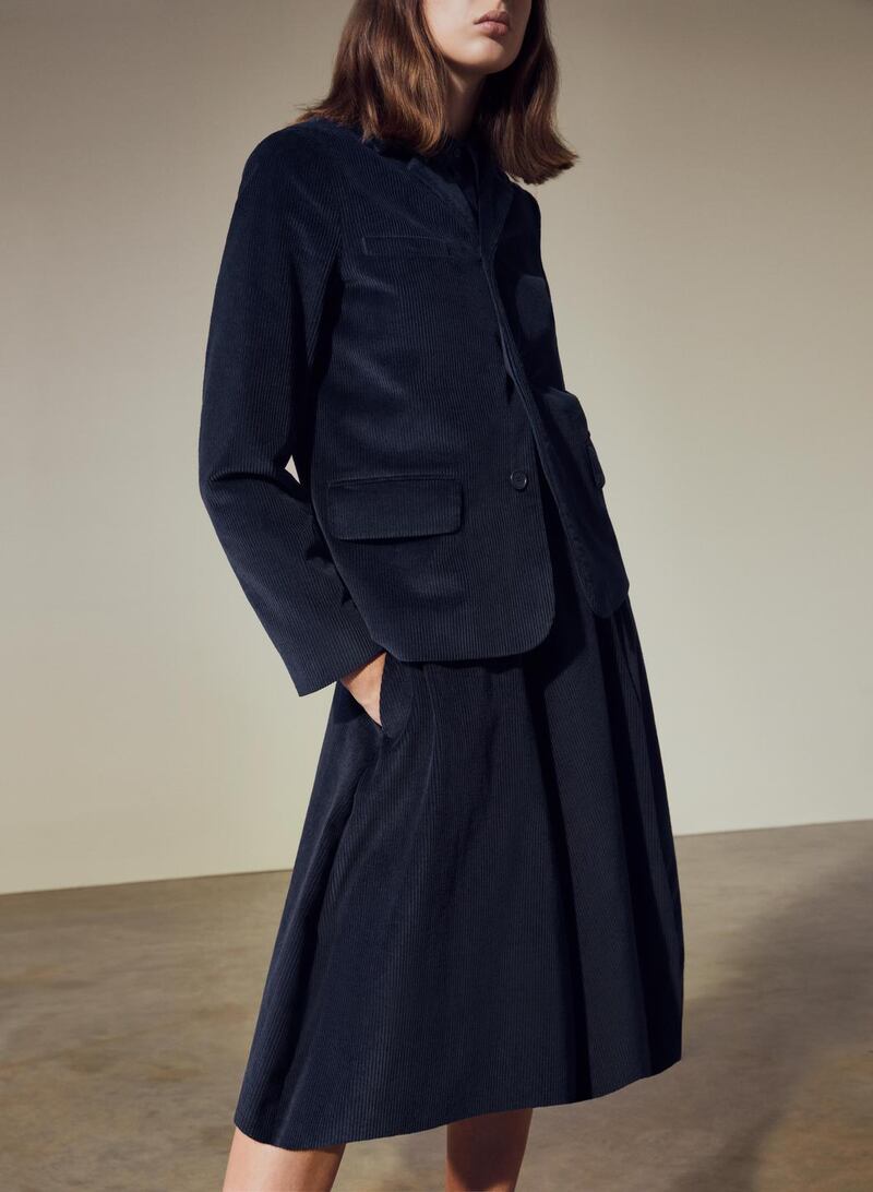 Navy cord blazer €125 and A-line panelled skirt €89 with block-heel shoes €150 – all from Cos.