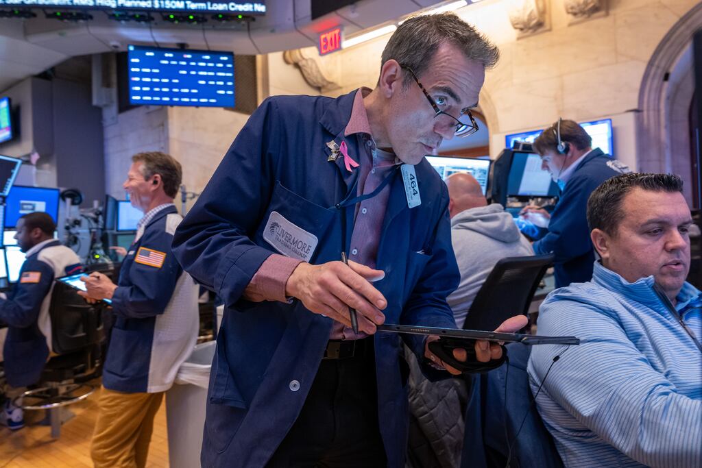 Traders work on the floor of the New York Stock Exchange. The benchmark S&P 500 and the Nasdaq were flat following a mixed bag of US earnings reports, while the Dow treaded water on the back of losses in industrial conglomerate 3M. Photograph: Spencer Platt/Getty