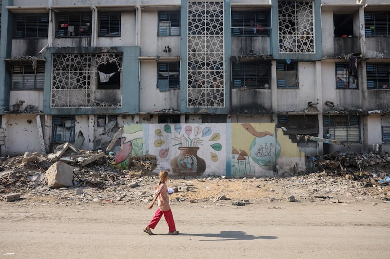 A girl walks near a camp for displaced Palestinians at a school-turned-shelter in Al-Rimal neighbourhood of Gaza City on November 5th. Photograph: Omar Al-Qattaa/ AFP via Getty Images