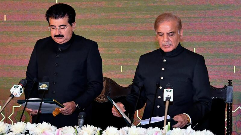 Acting president of Pakistan Sadiq Sanjrani, left, administers the oath of office to newly elected Pakistani prime minister Shahbaz Sharif. Photogrpah: Press Information Department via AP